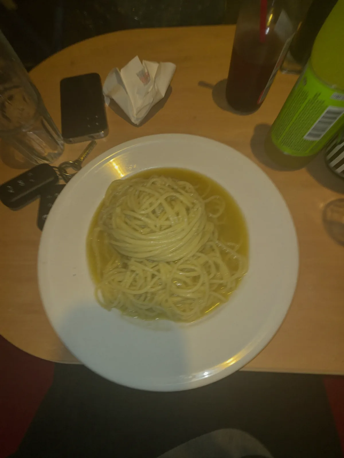 Restaurant dish shot on a phone under flat overhead light