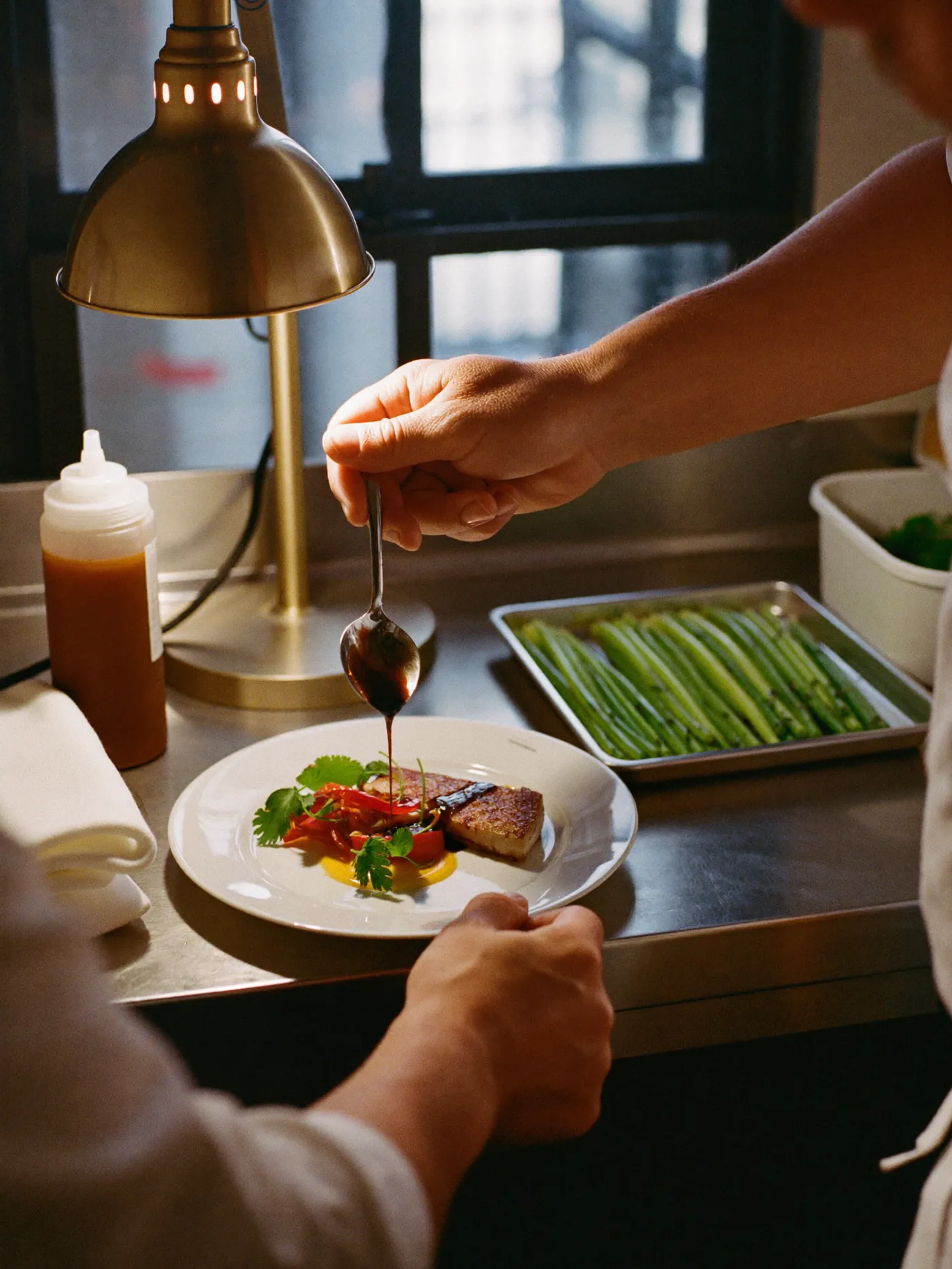 Chef hands finishing a plate